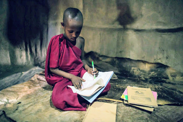 Child writing in notebook